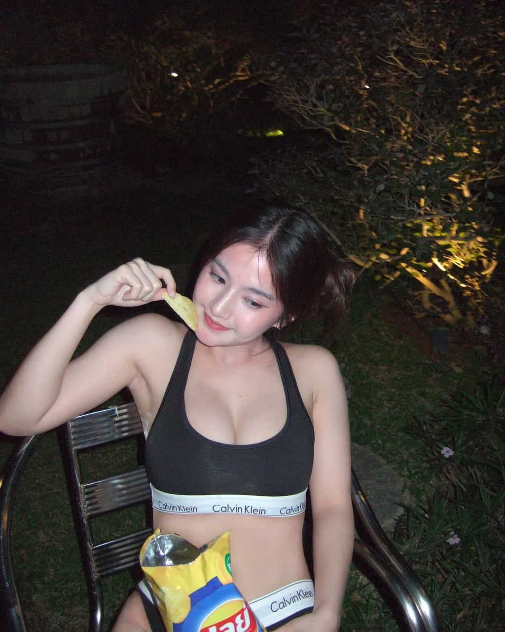 Bikini demo photo in the garden at night.