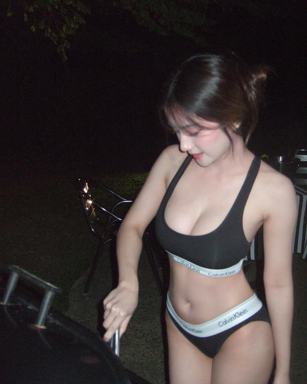Bikini demo photo in the garden at night.